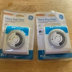 2X Ge 24-HOUR Heavy Duty Indoor Plug-in Mechanical Timer, Grounded Outlets. Fixed Price $17.95.